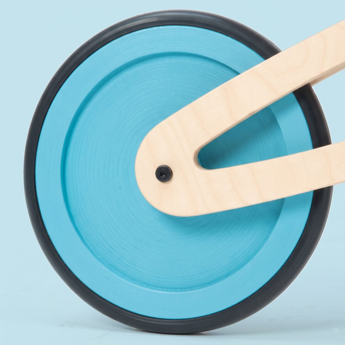 A Tochak wheel painted blue across the whole disc, set inside its black rubber tire.