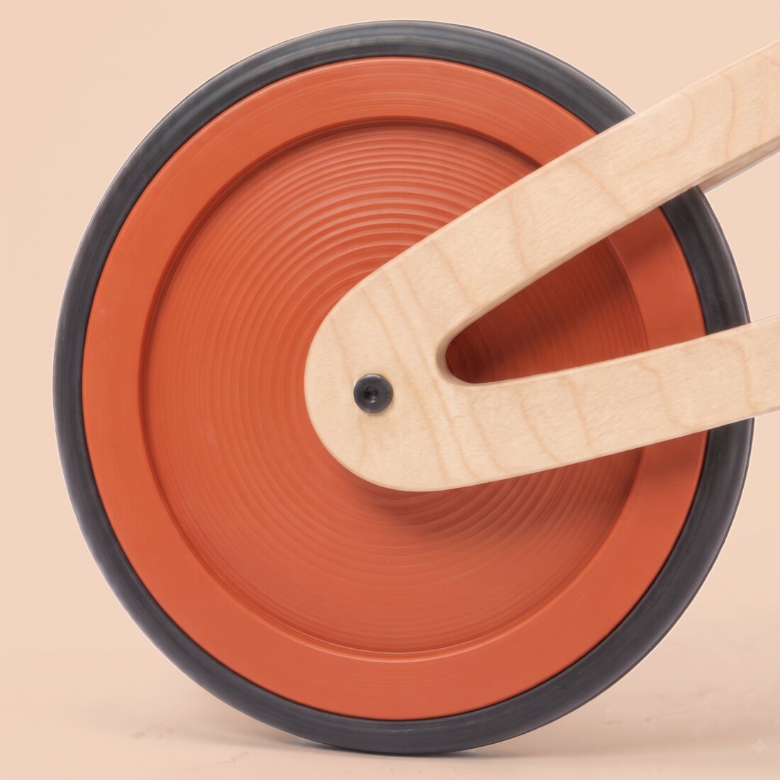 A Tochak wheel painted orange across the whole disc, with the Tochak mark branded on it.