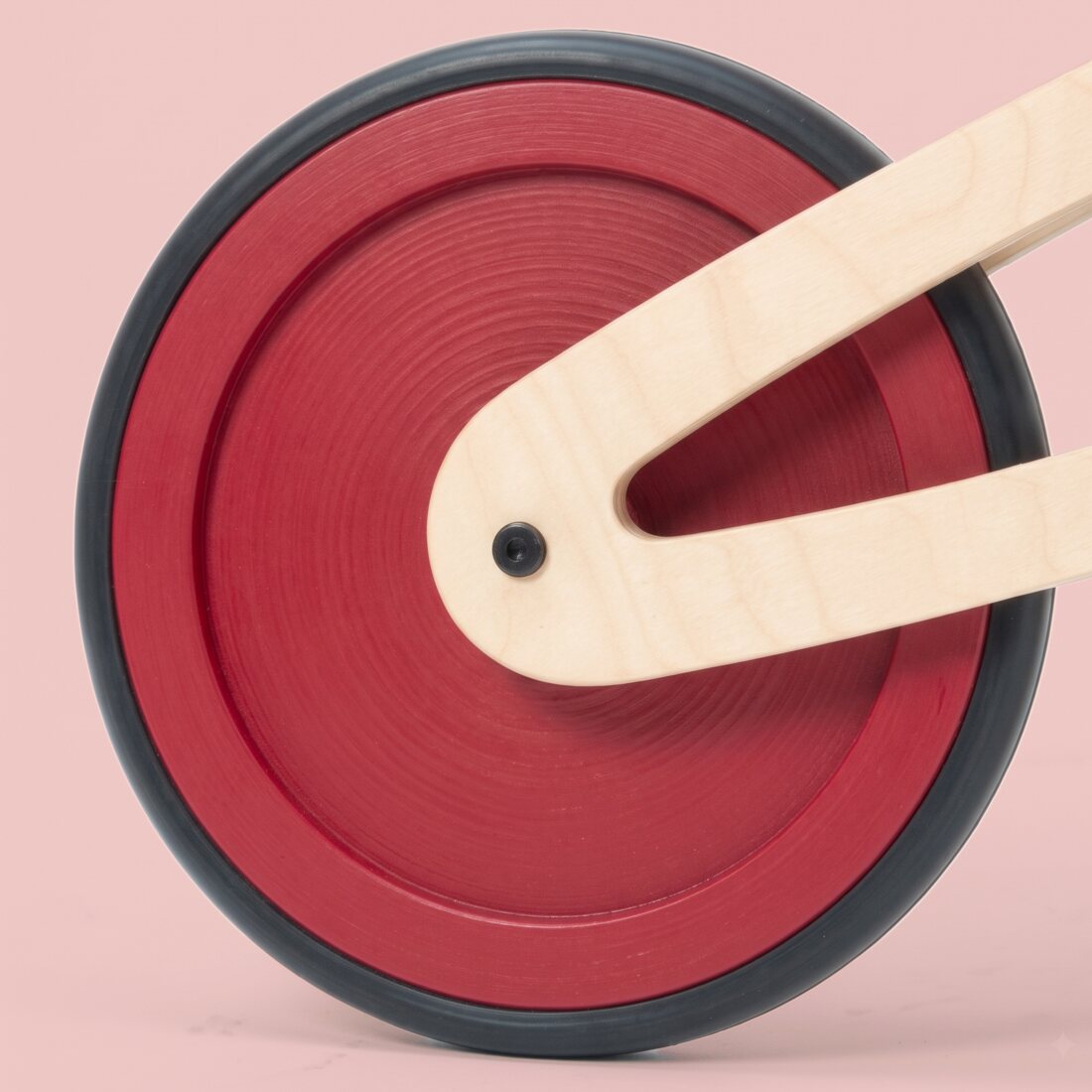 A Tochak wheel painted red across the whole disc, out to the black tire.